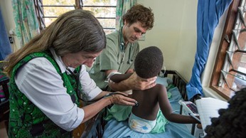 MSU doctor and students working with a patient in Malawi. 