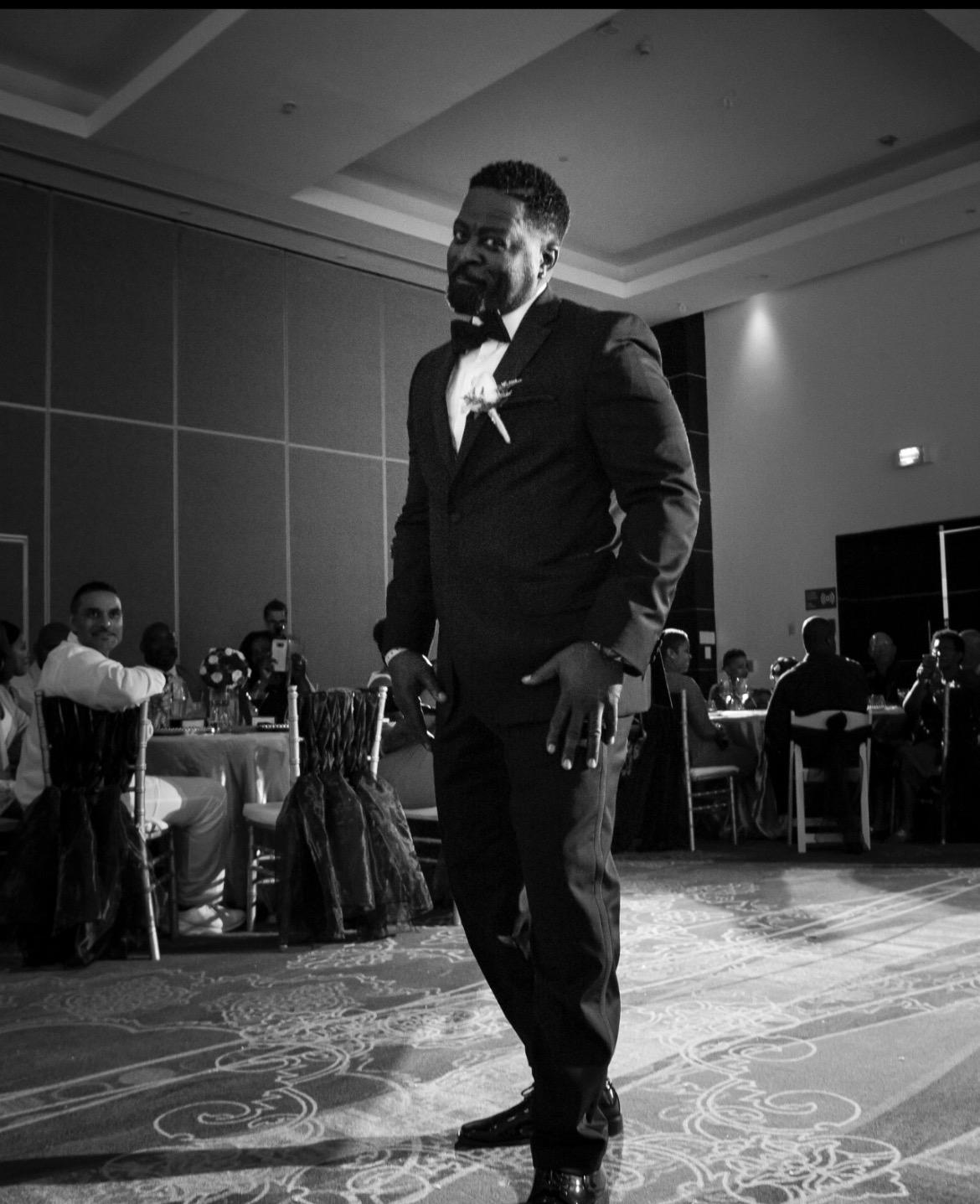 Black and white photo of Sherrod Johnson in a tuxedo.