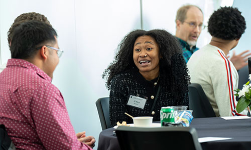 Image shows two students having lunch. 