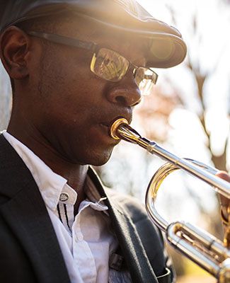 Carlot Dorve plays his trumpet