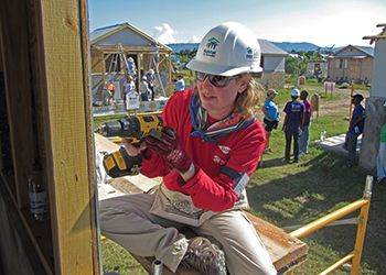 Sandra Pearson, '92 (Eli Broad College of Business) works on constructing a home.
