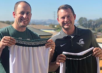 Aaron Loomer, ’02 (Agriculture and Natural Resources) and Chad Amo, ’02 (Communication Arts and Sciences) with their Spartan basketball shorts