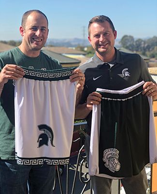 Aaron Loomer, ’02 (Agriculture and Natural Resources) and Chad Amo, ’02 (Communication Arts and Sciences) with their Spartan basketball shorts