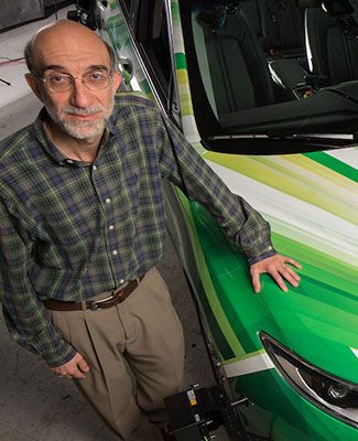 hayder radha poses with MSU's autonomous car