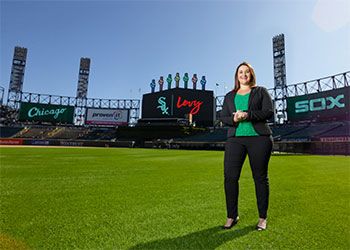 Courtney Cawley Gray, B.A. '04, Eli Broad College of Business, in a room overlooking white sox stadium