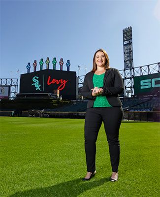 Courtney Cawley Gray, B.A. '04, Eli Broad College of Business, in a room overlooking white sox stadium