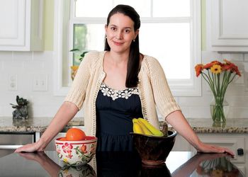 Science writer, Sheril Kirshenbaum poses in kitchen