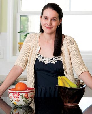 Science writer, Sheril Kirshenbaum poses in kitchen