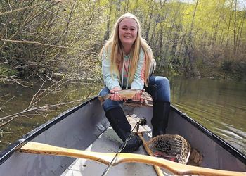 Ali Stark holds fish in her hands