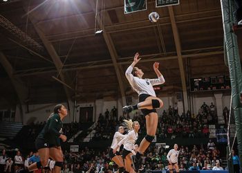 Allyssah Fitterer takes flight to spike volleyball