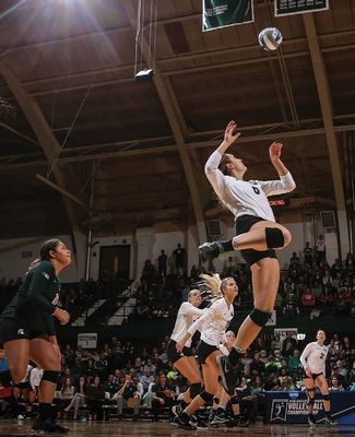 Allyssah Fitterer takes flight to spike volleyball