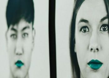 Students with lips painted teal from the student speak up campaign 