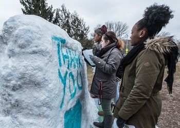 Students paint the rock