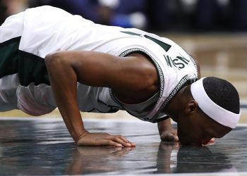 Cassius Winston kisses Spartan helmet on Breslin Center court