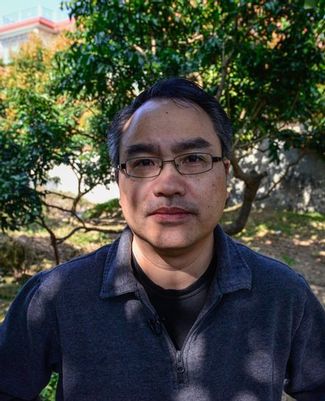 Click to enlarge                Zhiyong Xi, MSU assistant professor of microbiology and molecular genetics