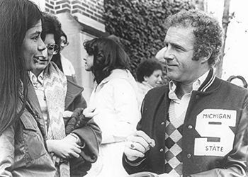 Actor James Caan signs an autograph for a woman on MSU campus