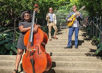 Spartan Jazz Trio pose on Beal garden steps.