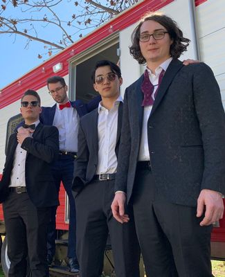 Group 2 poses in front of trailer