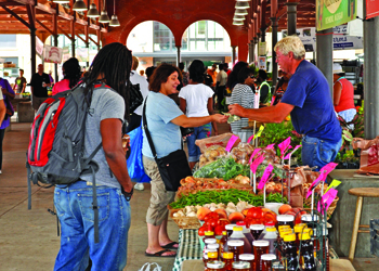 People shopping at an outdoor market. 