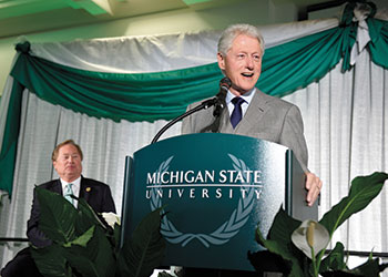 Bill Clinton speaks to students and dignitaries