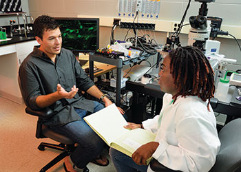 Dr. Brian Gulbransen and a student in the lab