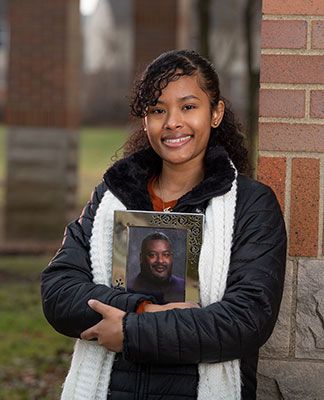 jessica wright holds a photo of her father