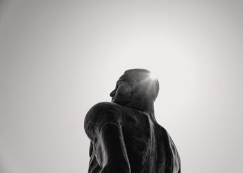 Spartan statue with sun over shoulder