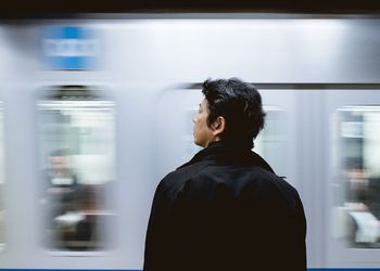 Commuter waits for train.