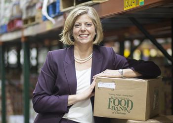 Katie Fitzgerald stands in food bank