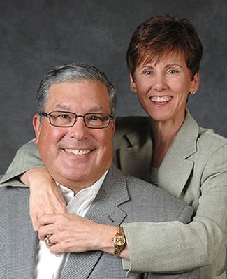 A formal portrait of Bob and Julie Skandalaris