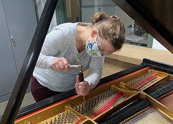 Mary Lapprand in the piano shop