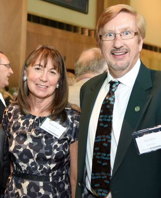 Daniel and Debra Edson pose with President Simon at a formal event