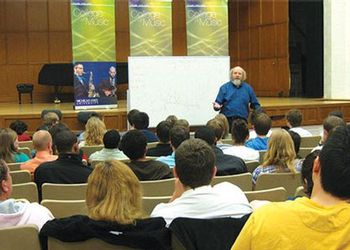 John Kratus presents to an auditorium filled with music education students
