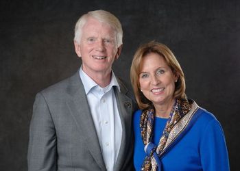 Craig and Vicki Brown, in formalwear, pose for a portrait