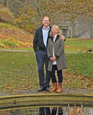 Joe and Laurie Thorp pose near the Beal Garden pond in the fall