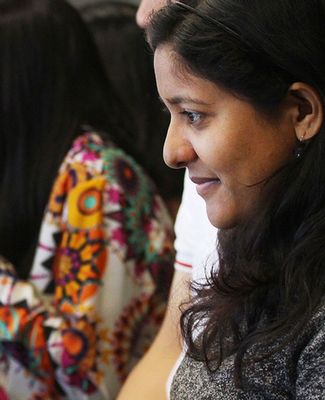 Business students work at laptop computers