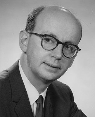 A black and white photo of Dr. W. Paul Strassmann.