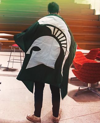 MSU student with Spartan Flag