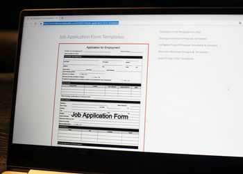 A job application form is opened on a computer