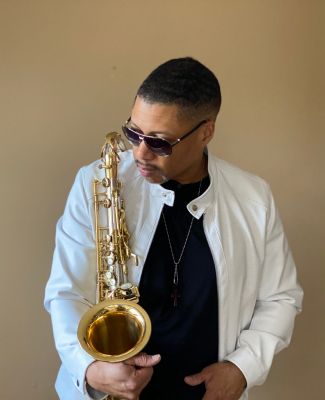 Randy Scott holding saxophone