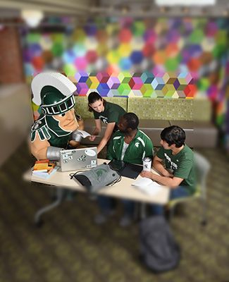 Sparty and James Madison College Students hard at work studying