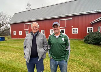 the oswaldts standing in front of their family farm