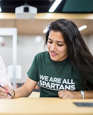 MSU student wearing a shirt that says, 