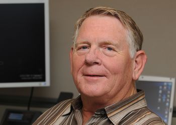 Visionary, inventor and Oscar winner Gary Starkweather sitting in an office