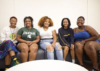 five smiling female students celebrate the launch of the Department of African and African American Studies