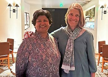 Alumna Priya Balasubramaniam and faculty member Helen Dashney pose together