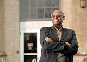 Julian Chambliss stands outside the entrance to the MSU Museum