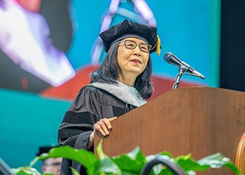 Okhee Lee speaking at the Fall Commencement in December 2022.