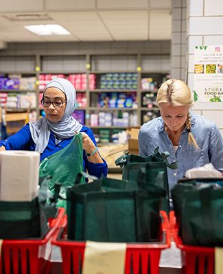 Student Volunteers fill food bags at the MSU Student Food Bank