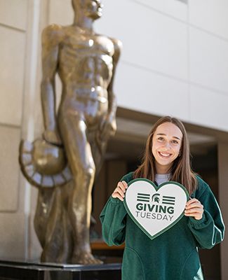 Spartan Statue and MSU student